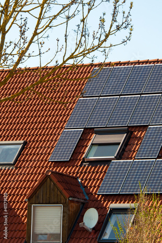 Solar Panels On A Red Roof