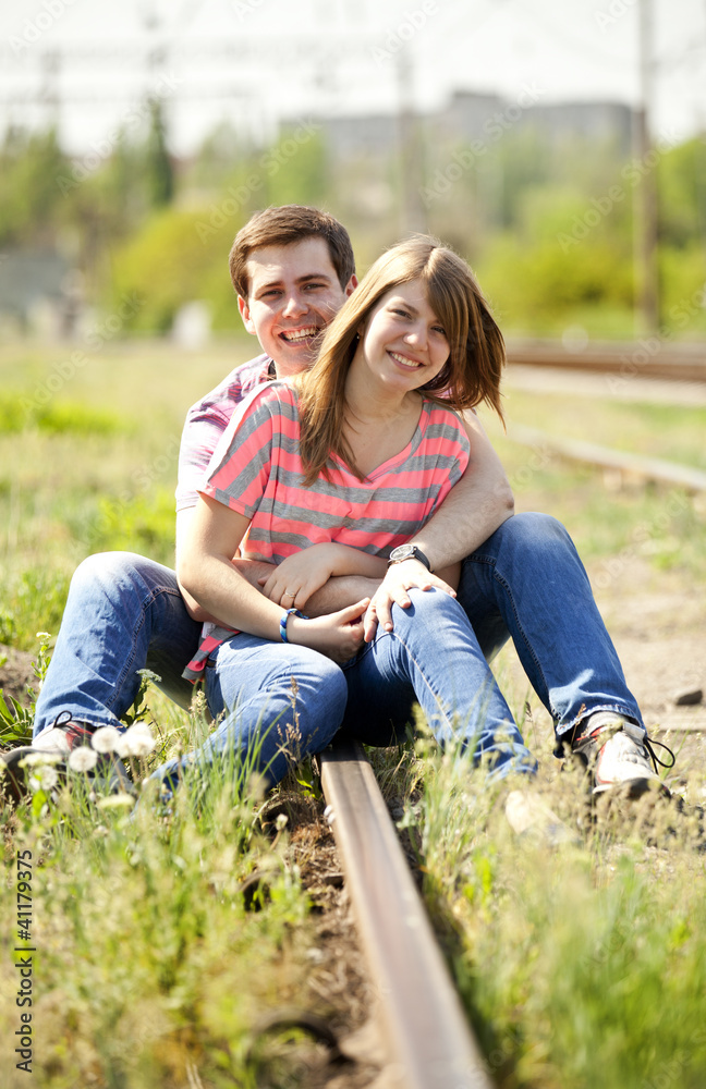 Fototapeta premium Couple sitting at railway.