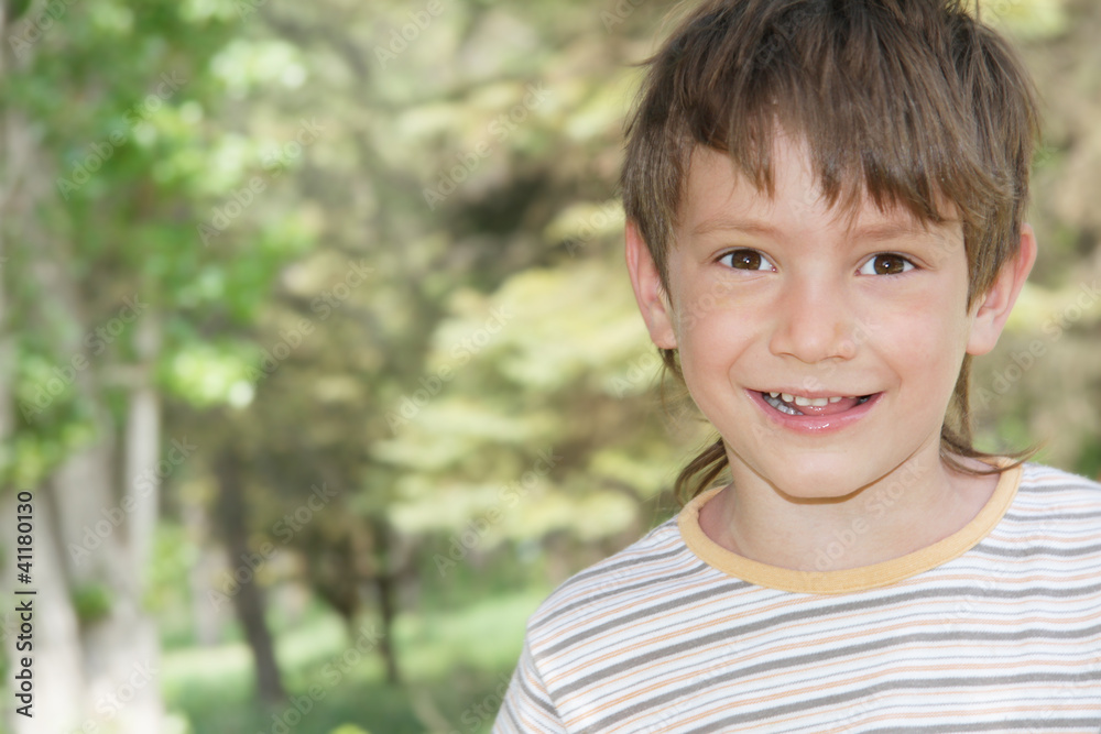 young happy boy on natural background young happy boy on natural background