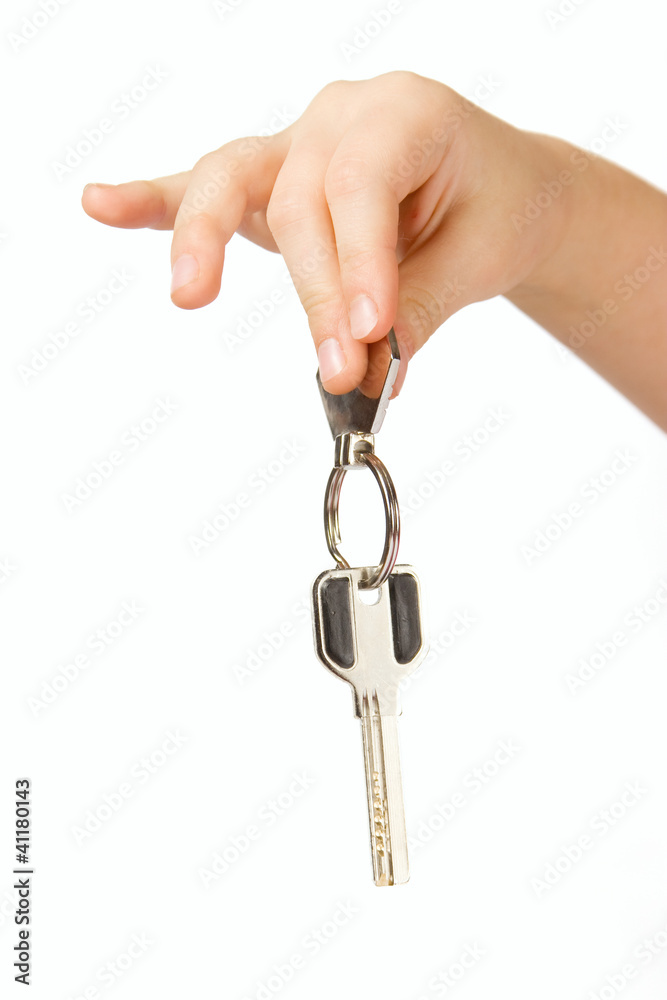 Fingers holding Golden key isolated over white Fingers holding Golden key isolated over white