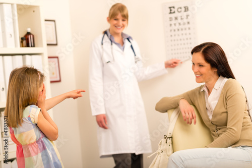Wallpaper Mural Girl reading eye chart pediatrician office Torontodigital.ca