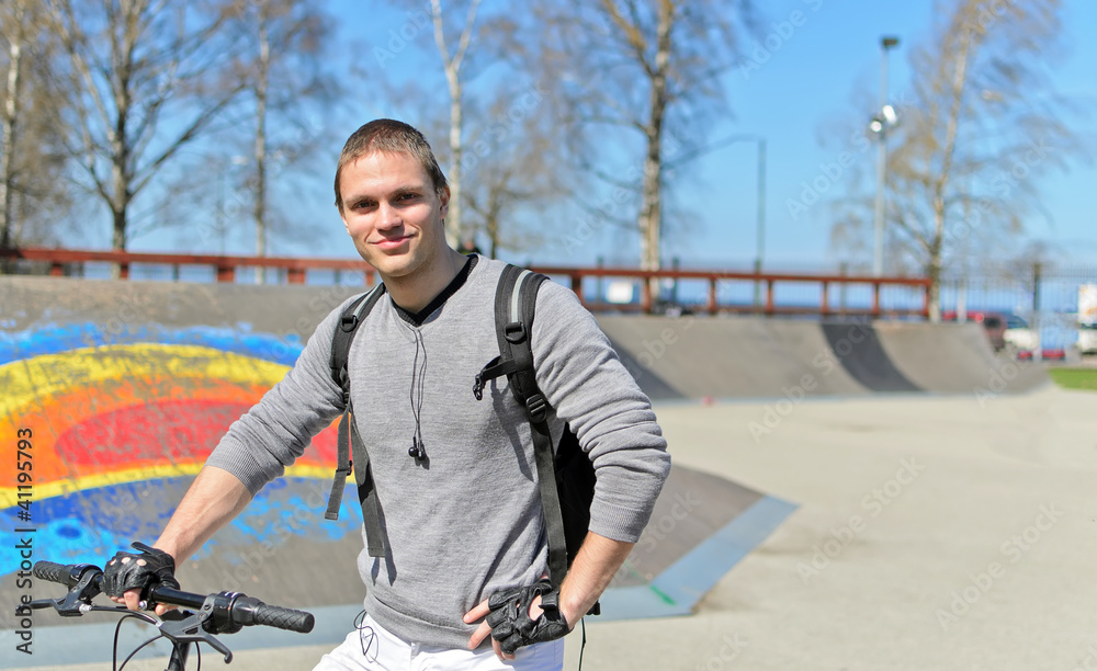 Portrait of BMX bicycle rider on urban skatepark background Portrait of BMX bicycle rider on urban skatepark background