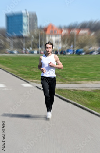 Motion Blur: Athletic young male running © M-Production