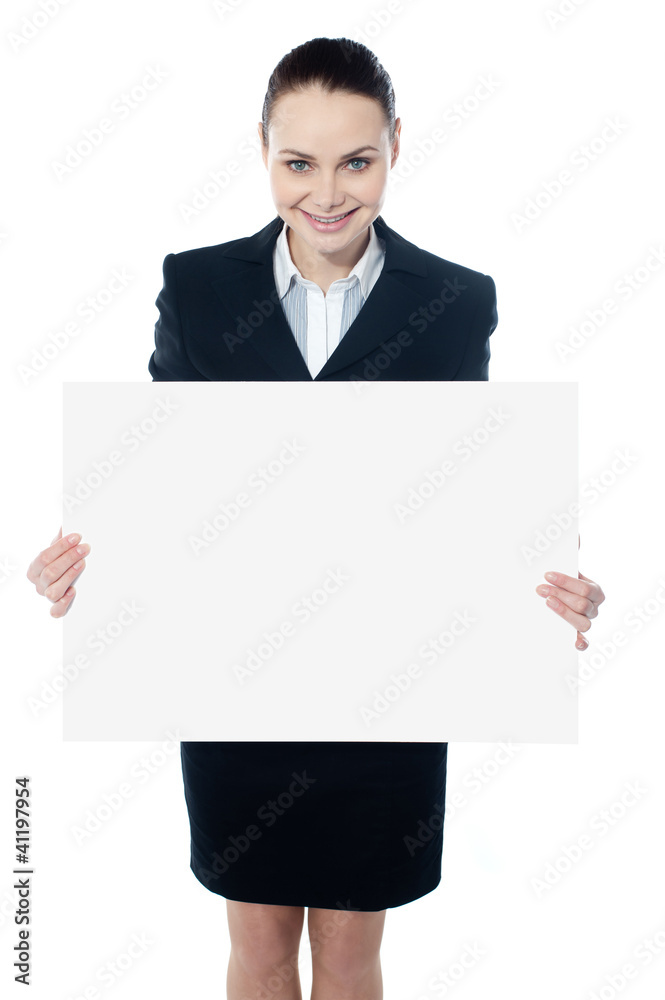 Female executive showing blank billboard to camera Female executive showing blank billboard to camera