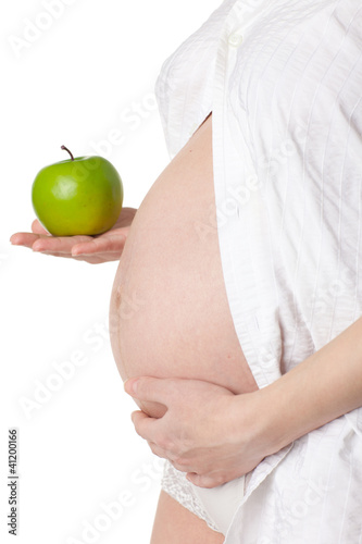 Pregnant woman with apple.