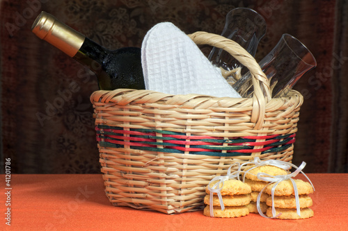 basket with bottles and glasses
