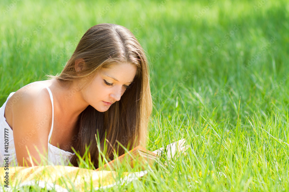 young beautiful girl with book in nature young beautiful girl with book in nature