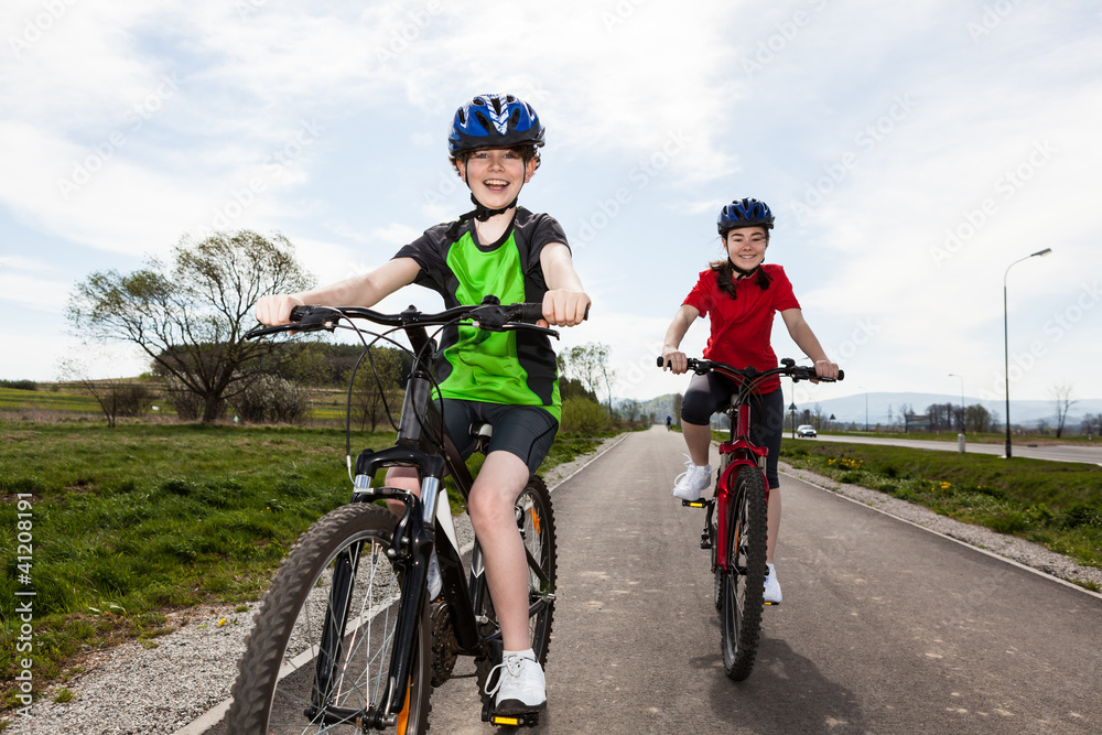 Girl and boy cycling