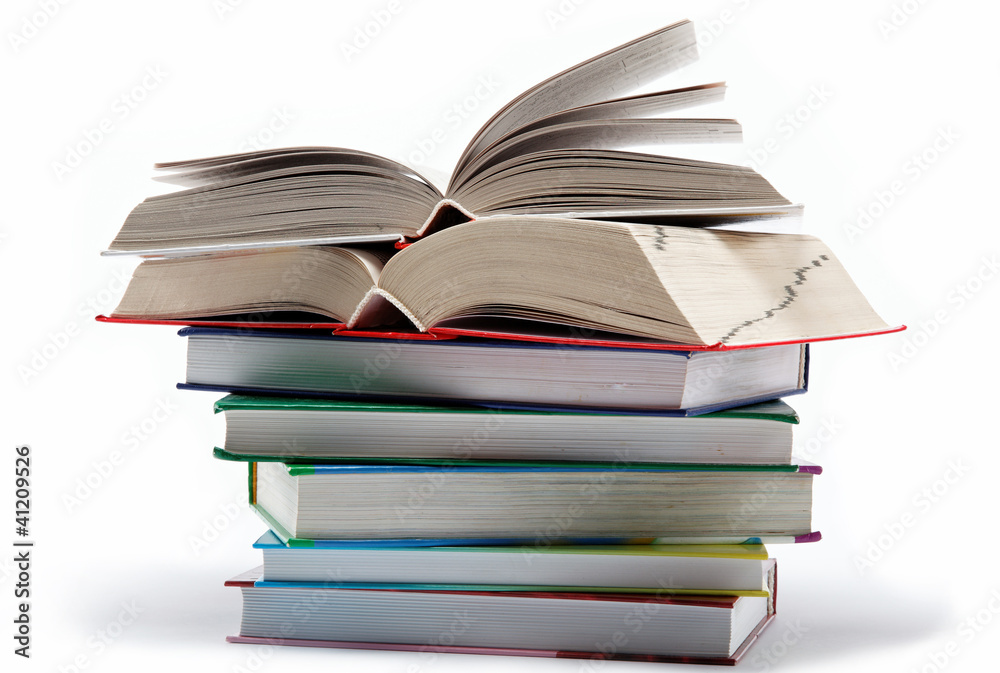 A stack of books on a white background. A stack of books on a white background.