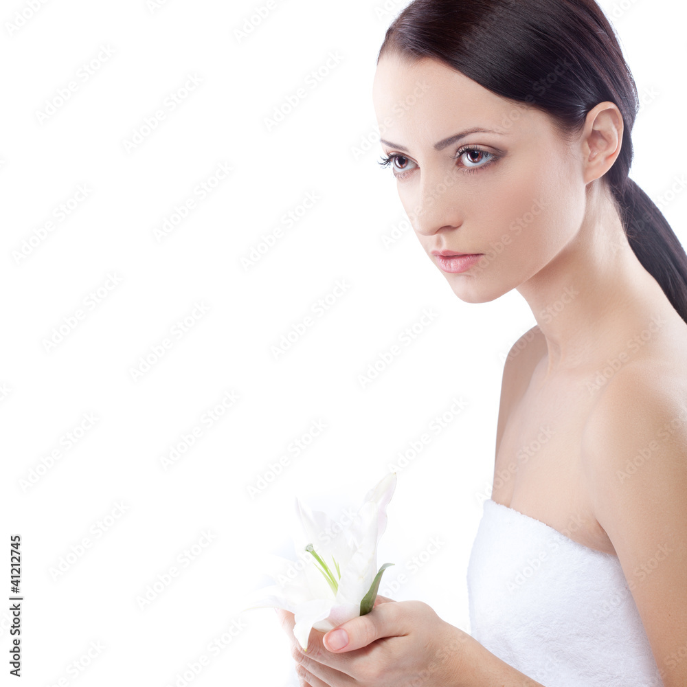 Fototapeta premium serioulsy woman holding lily flower