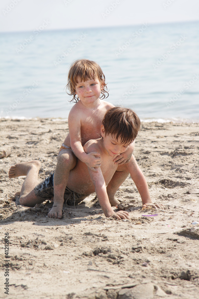two children playing on beach