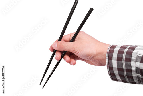 Hand with chopsticks isolated on white background