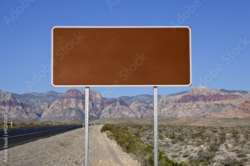 Fototapeta Naklejka Na Ścianę i Meble -  Blank Brown Highway Sign in the Mojave Desert