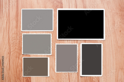 Set  old, blank picture on table. picture on wooden background