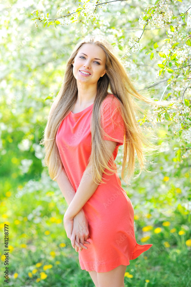 Portrait of beautiful woman in blooming tree in spring Portrait of beautiful woman in blooming tree in spring