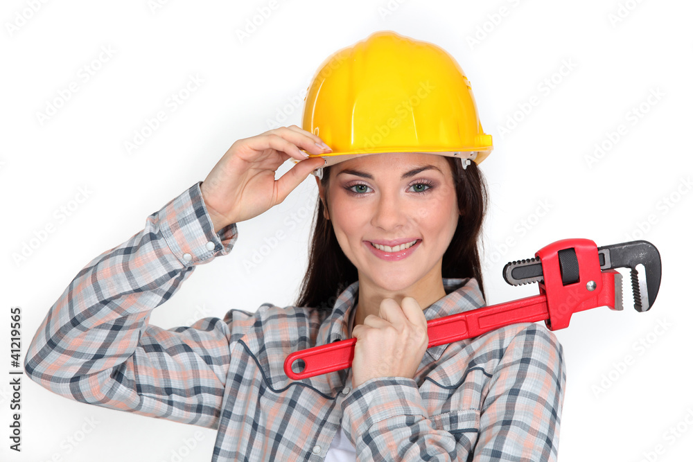 A cute construction worker with a wrench. A cute construction worker with a wrench.