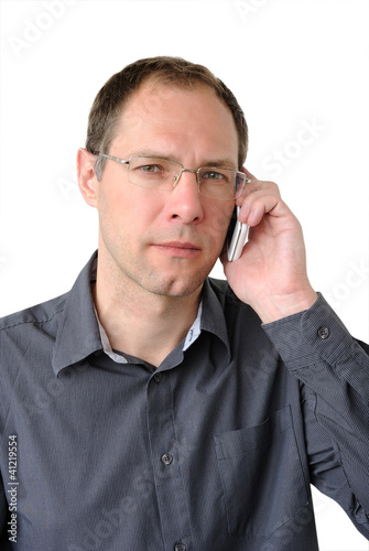 Portrait of a handsome business man speaking over phone