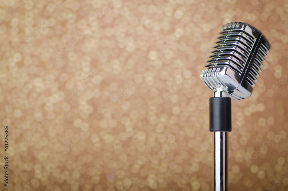 Fototapeta premium Old vintage microphone on background