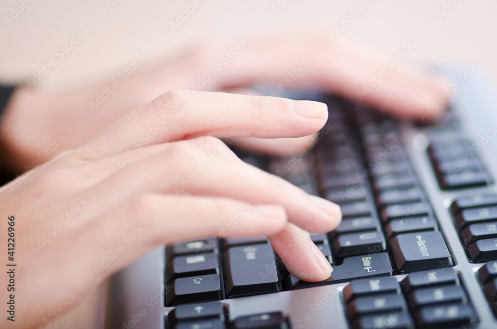 Hands typing on the keyboard Hands typing on the keyboard