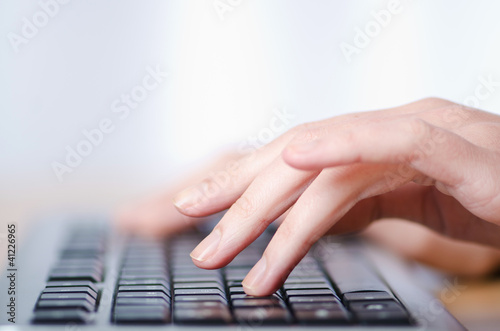 Hands typing on the keyboard