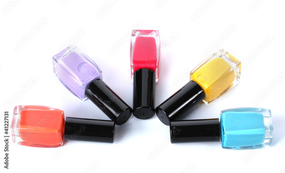 Group of bright nail polishes isolated on white Group of bright nail polishes isolated on white
