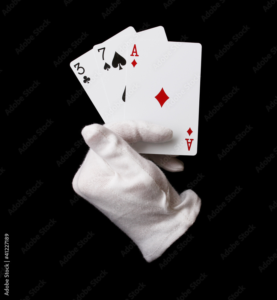 Obraz premium Cards in hand isolated on black