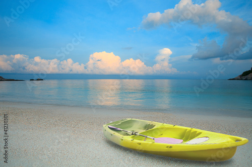 yellow sea kayak on sand beach