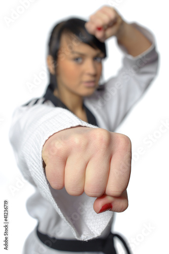 Taekwondo. Woman in a kimono on the white background