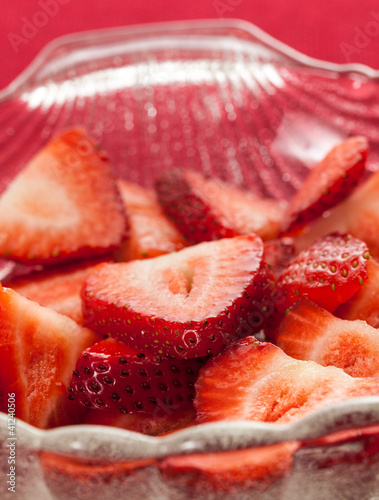 Fresh sliced strawberries in glass dish