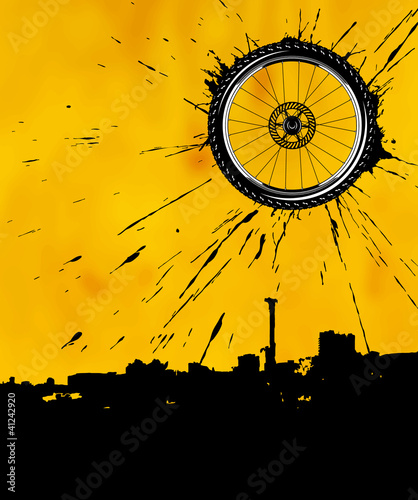 Bike wheel over the city