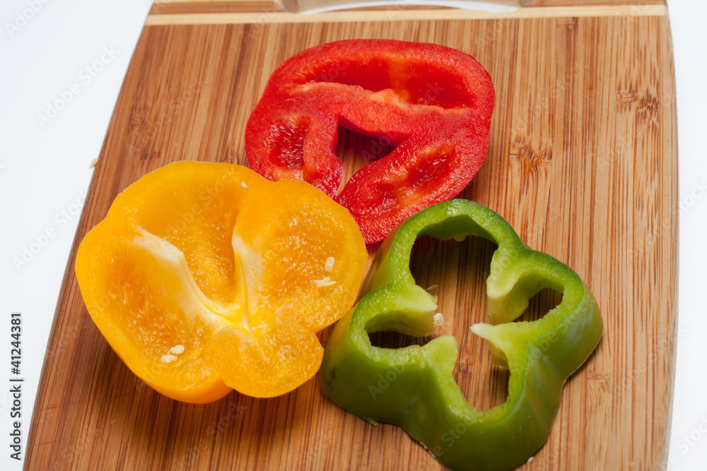 close up of red, yellow and green peppers close up of red, yellow and green peppers
