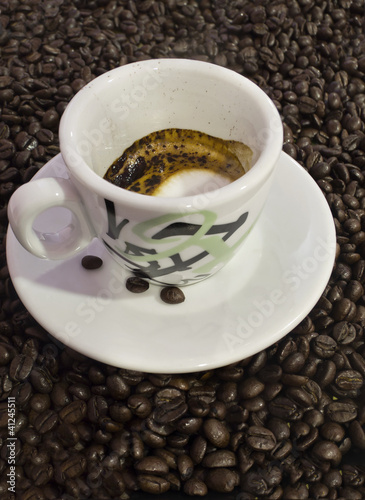 Coffee cup and grain background