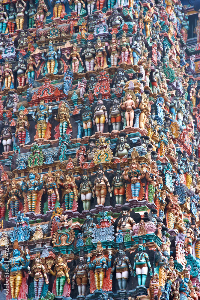 wall of colourful sculptures on Hindu temple, India