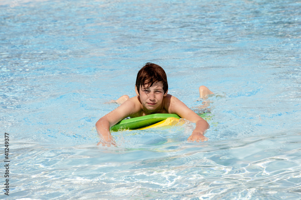 boy surfing in the pool