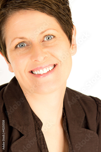 Close up of smiling mature businesswoman in a brown suit