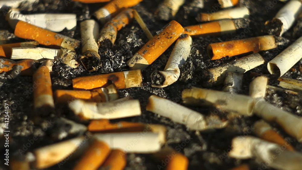 Panoramic shot of multiple cigarette butts