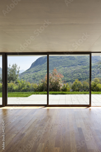 modern concrete house with hardwood floor  large window