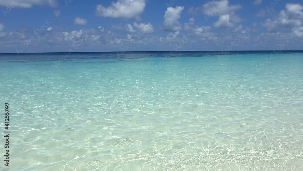 Beach and crystal clear waves in Maldives Beach and crystal clear waves in Maldives