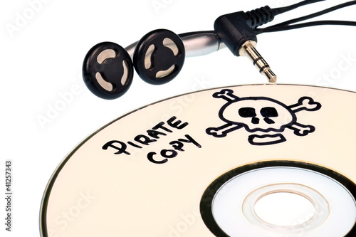 Картината върху платно Music piracy with pirate copy cd and headphones