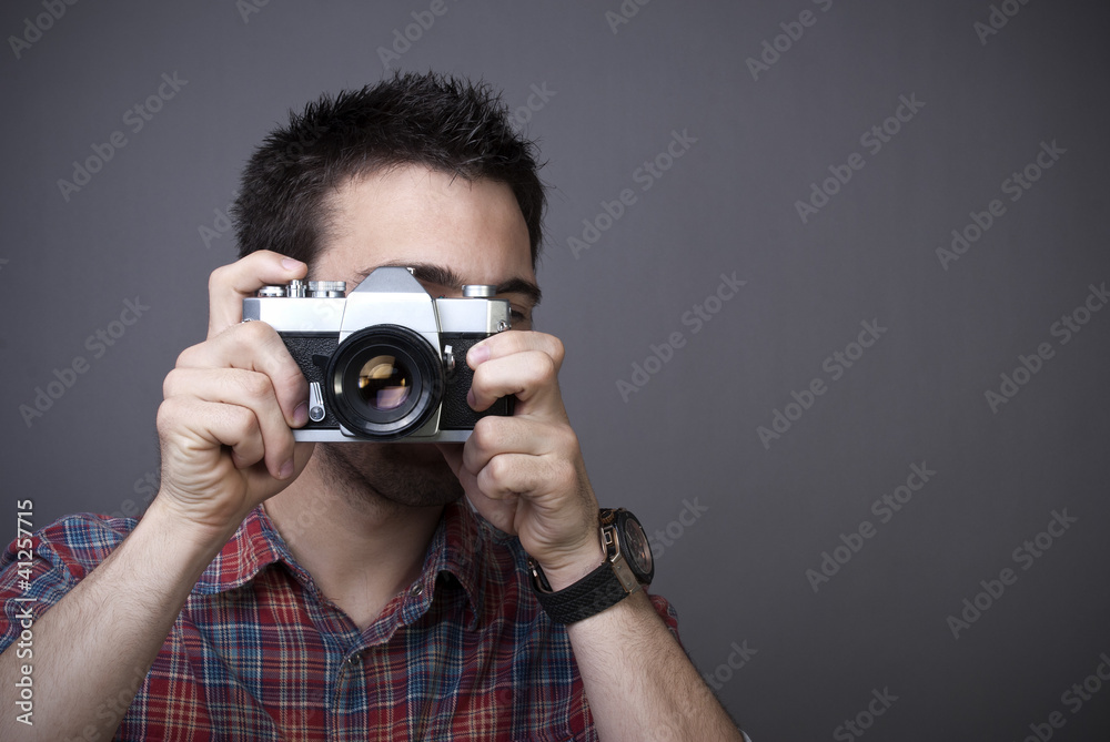 Young man with retro photo camera Young man with retro photo camera