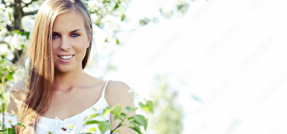 portrait of young lovely woman in spring flowers portrait of young lovely woman in spring flowers