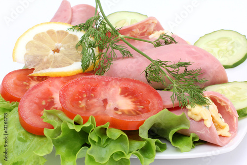 Sausage and salad on plate