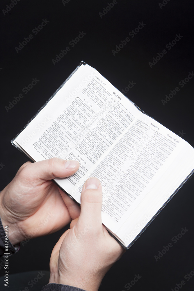 Fototapeta premium bible in hands of man
