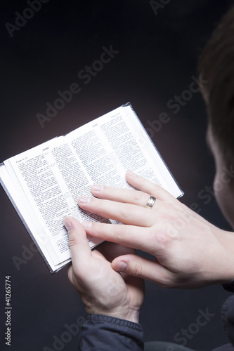 man holding bible with glow effect