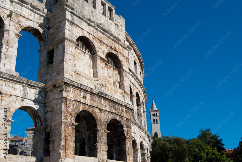 Coliseum and church tower in Pula