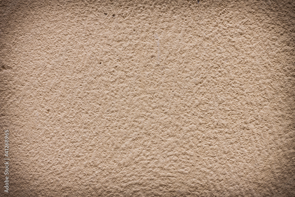 Dark yellow plaster wall with old texture