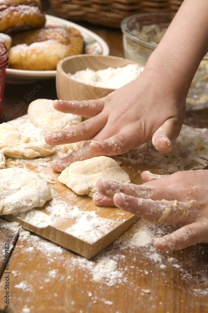 Detail of hands kneading dough Detail of hands kneading dough