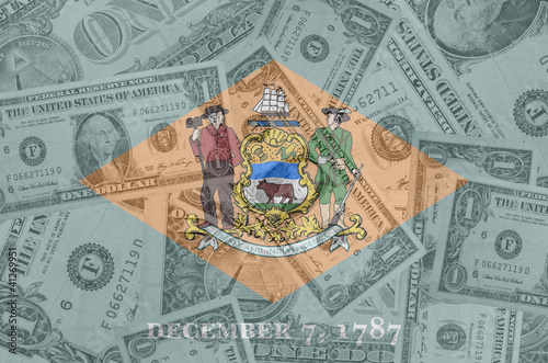 US state of delaware flag with transparent dollar banknotes in b