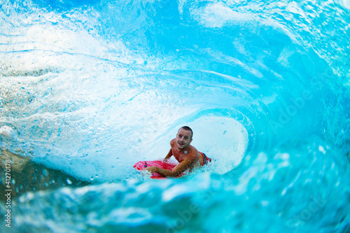Boogie Boarder in the Barrel Riding Blue Ocean Wave © EpicStockMedia