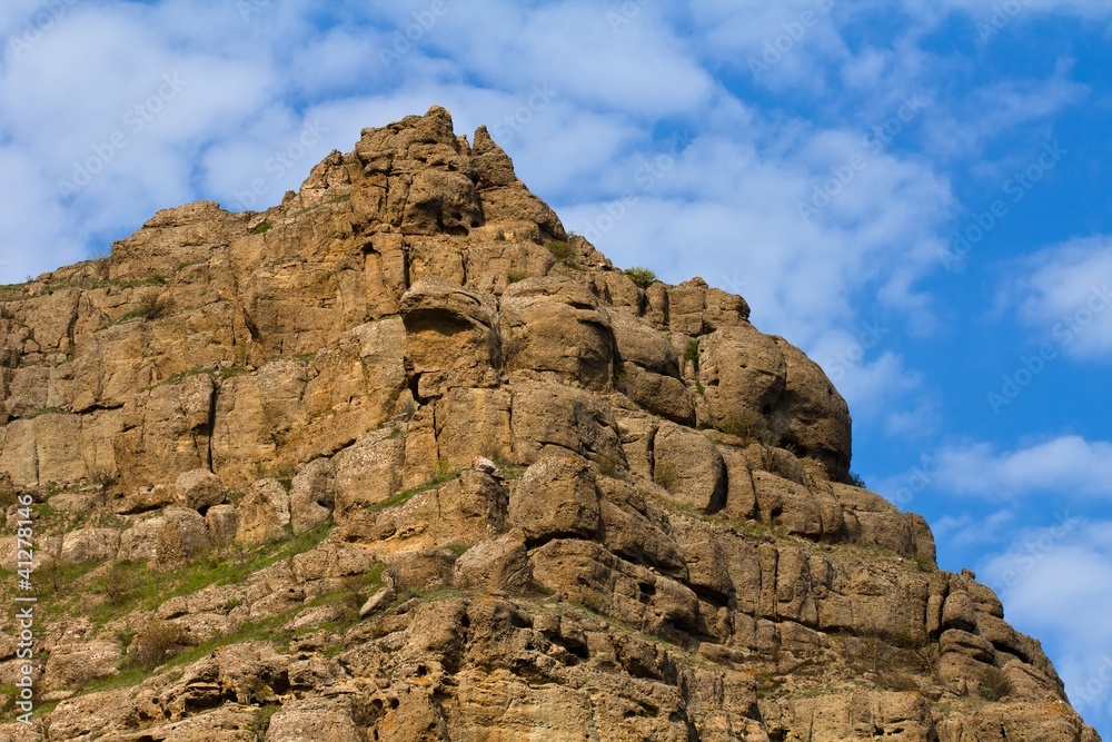 mountain top on a blue sky background